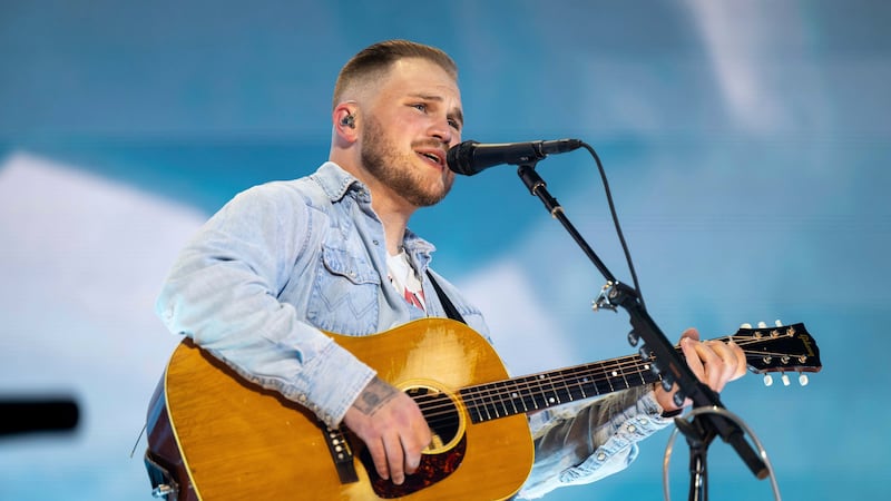 FILE - Zach Bryan performs during The Quittin Time Tour at Mercedes Benz Stadium on Aug. 10,...